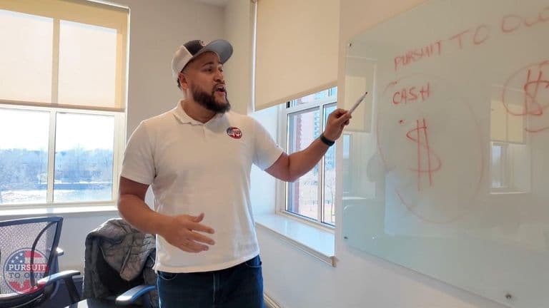 Image ALT Text Generator said: Christopher Pitt teaching financial literacy and homeownership strategies at Pursuit To Own.