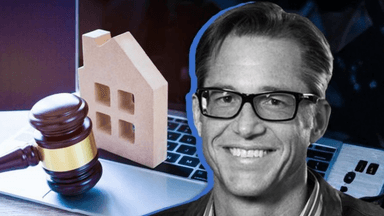 Gavel, miniature house, and laptop representing real estate law and online transactions