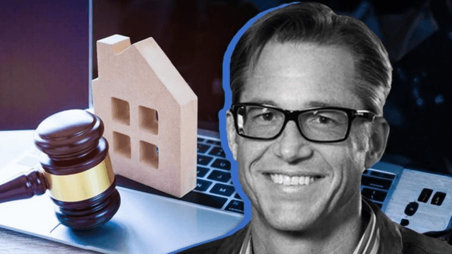 Gavel, miniature house, and laptop representing real estate law and online transactions