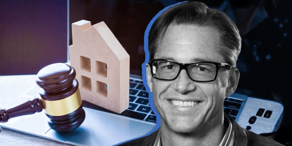 Gavel, miniature house, and laptop representing real estate law and online transactions