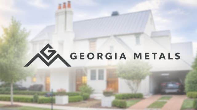 Georgia Metals logo displayed over a modern home featuring a light-colored metal roof.