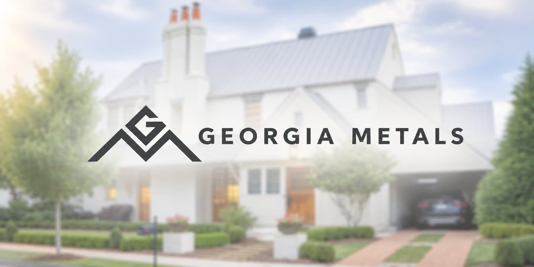 Georgia Metals logo displayed over a modern home featuring a light-colored metal roof.