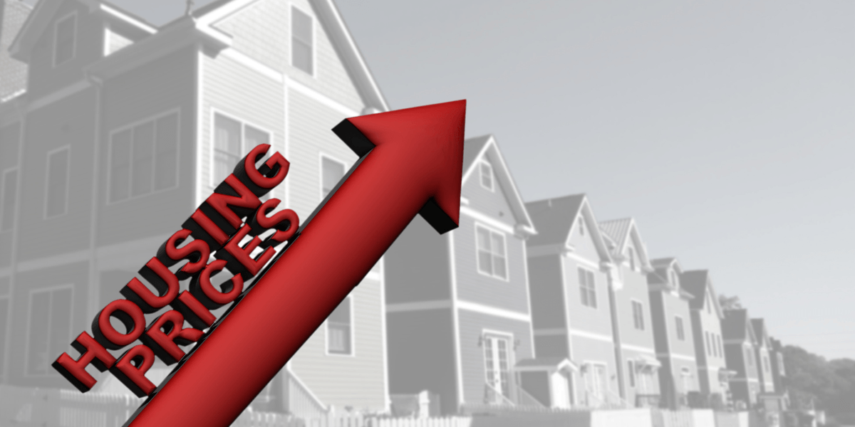 Red upward arrow labeled "Housing Prices" in front of residential homes.