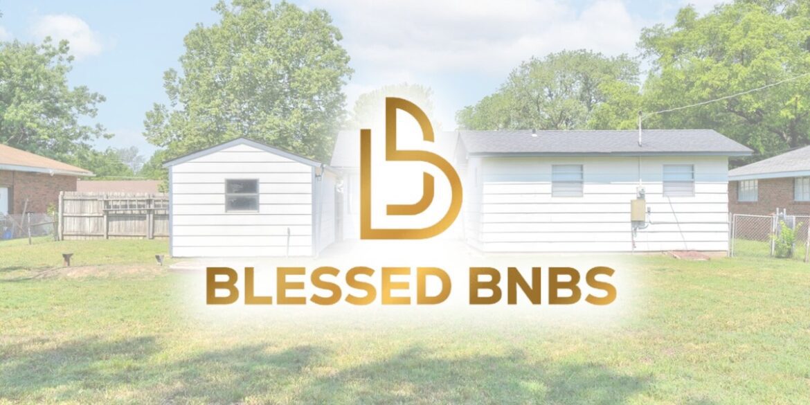 Exterior of a Blessed BNBS property featuring a white house with a well-maintained lawn and a small shed.